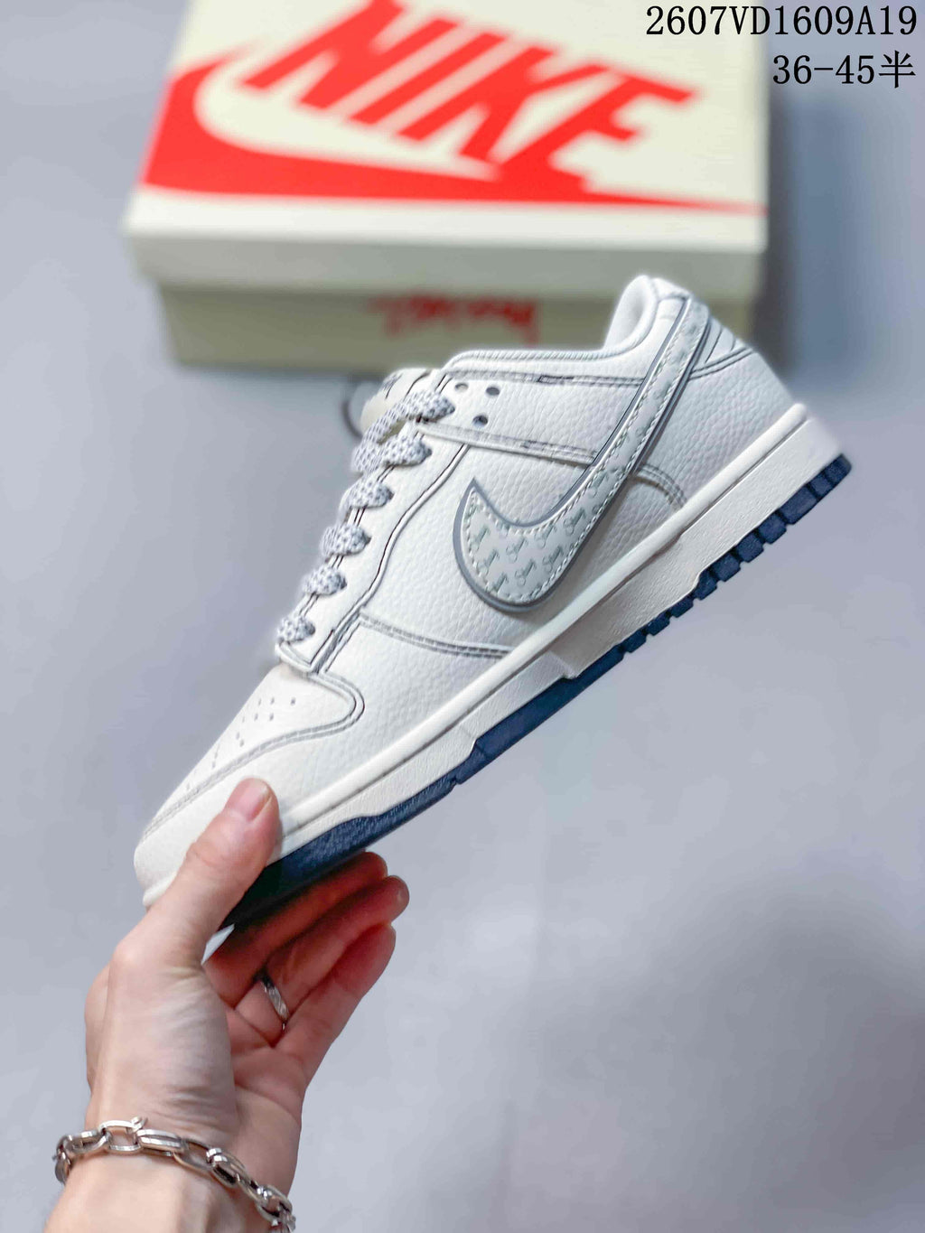 Nike Dunk Low Retro Sneakers in White Navy 2607VD1609A19 - product image from the listing.