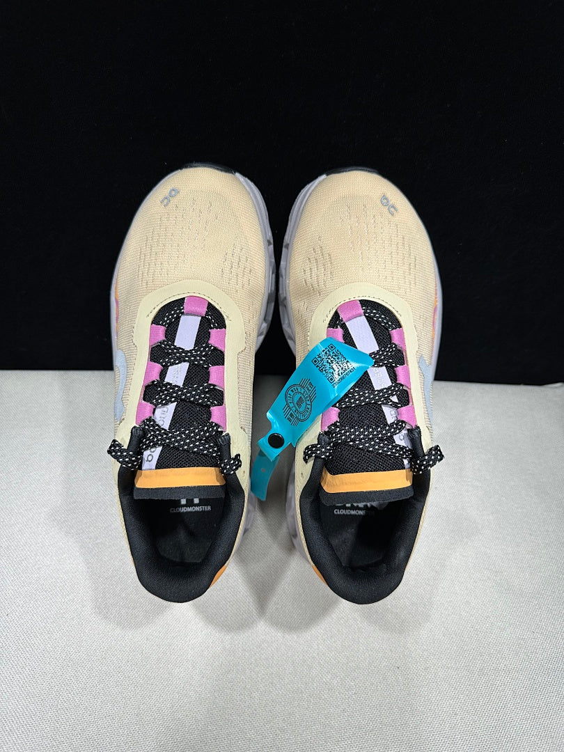 On Cloudmonster Running Shoes, in Pale Yellow and Orange - product image from the listing.