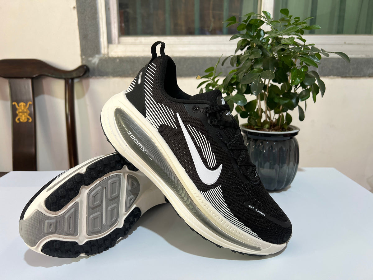 Nike Vomero 18 Running Shoes in Black and White - product image from the listing.