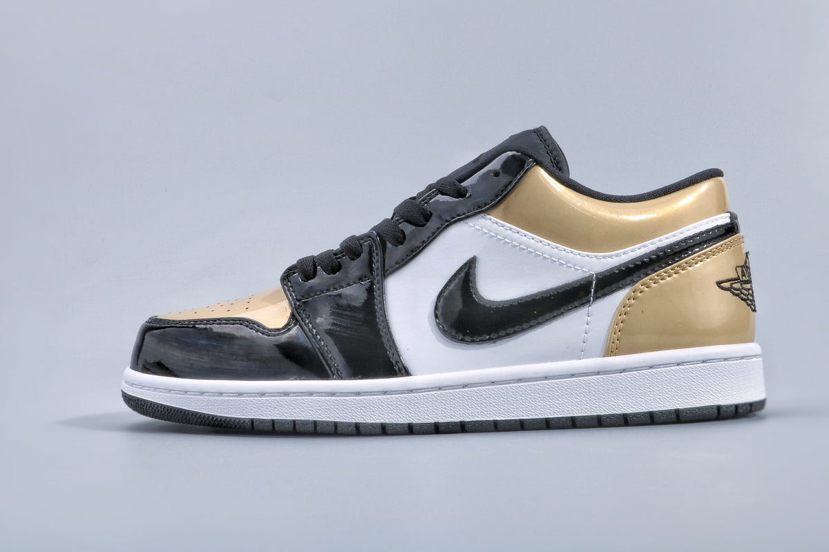 Jordan 1 Low Gold Toe Sneakers in Black and Metallic Gold - product image from the listing.