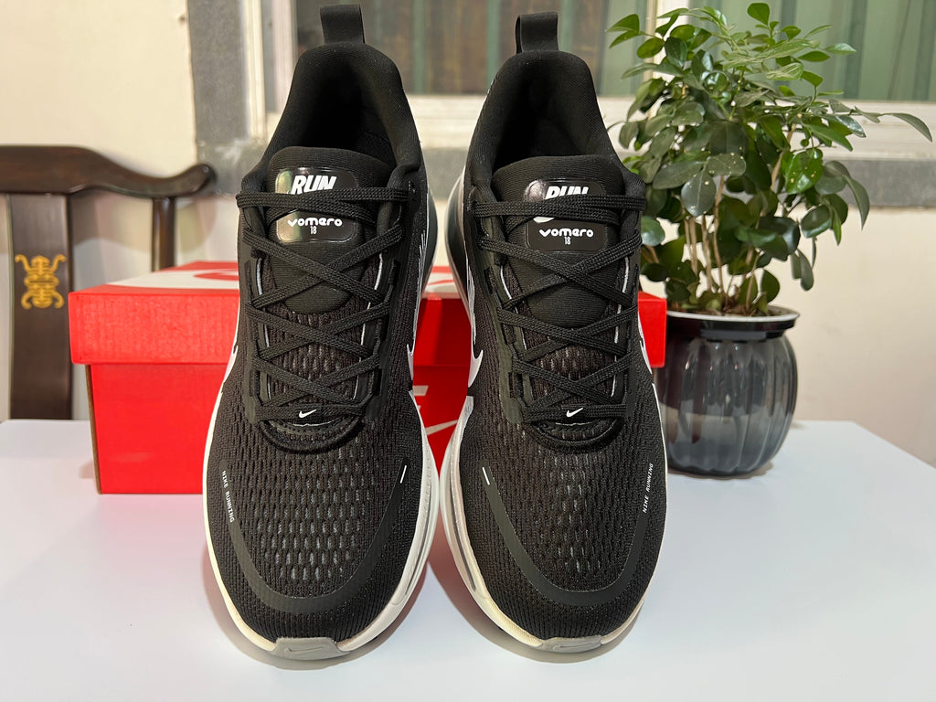 Nike Vomero 18 Running Shoes in Black and White - product image from the listing.