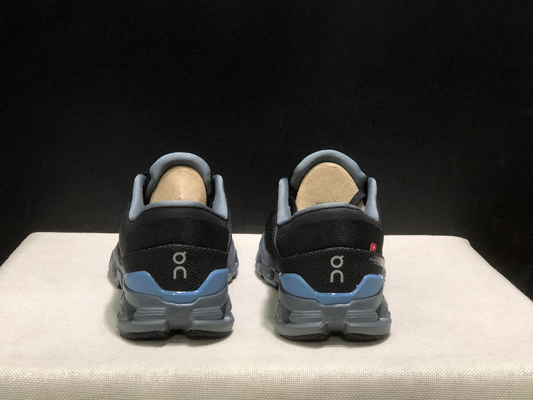Black and Blue On Cloud X 4 Sneakers - product image from the listing.