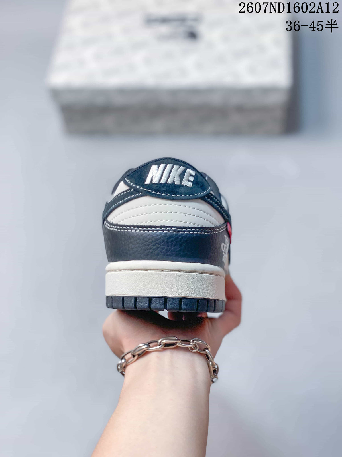 Nike SB Dunk Low North Face Color-Block Trainers - product image from the listing.