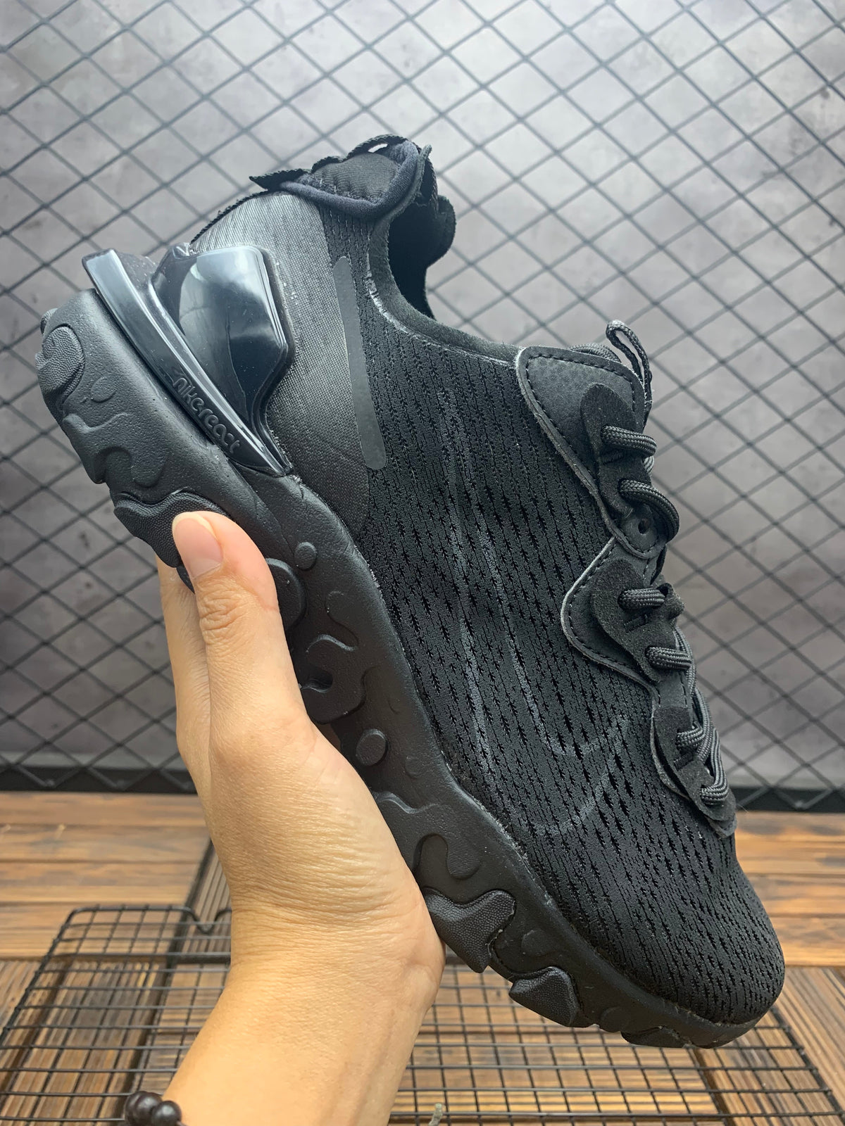 Nike React Vision All-Black Trainers - product image from the listing.
