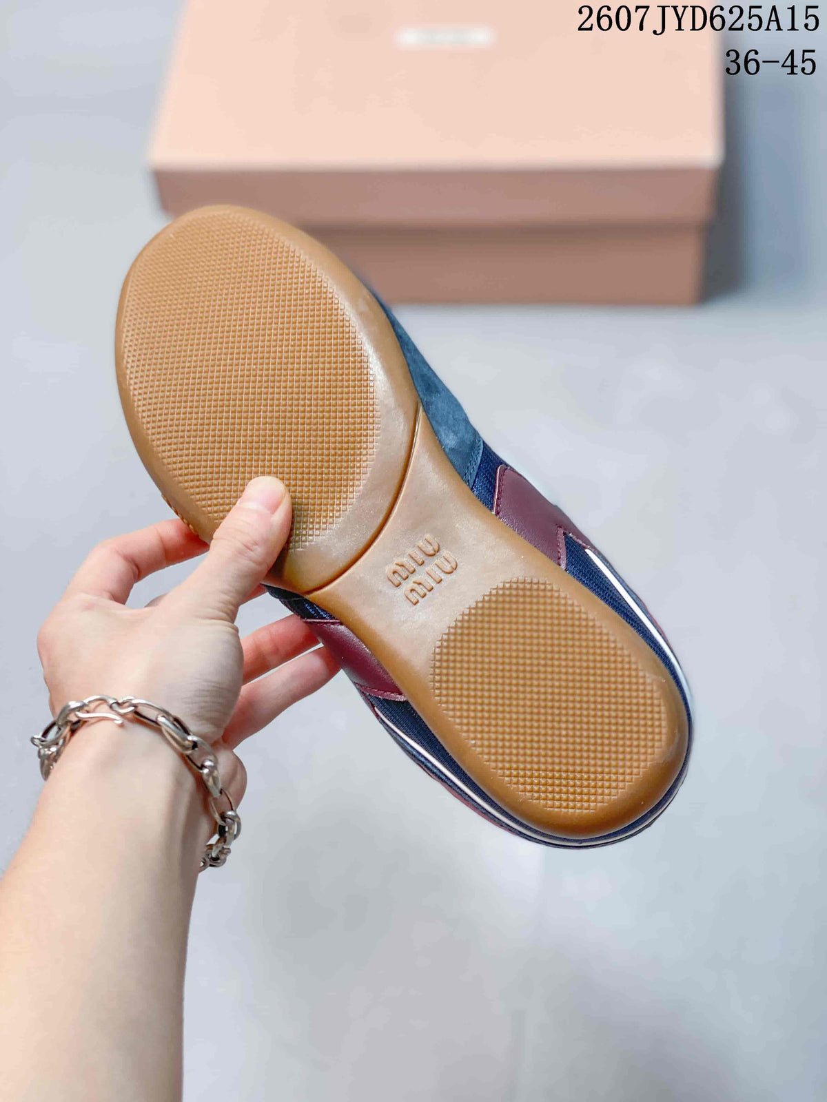 Miu Miu Gymnasium Low-Top Sneakers in Navy Red 2607JYD625A15 - product image from the listing.