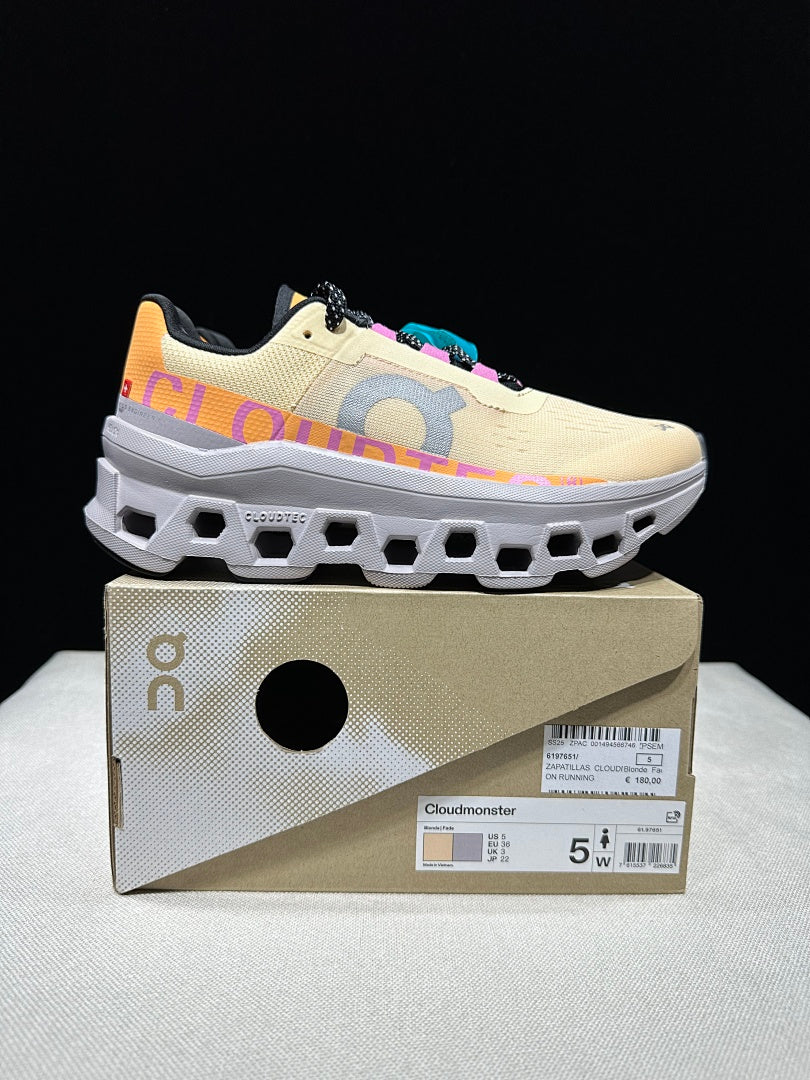 On Cloudmonster Running Shoes, in Pale Yellow and Orange - product image from the listing.
