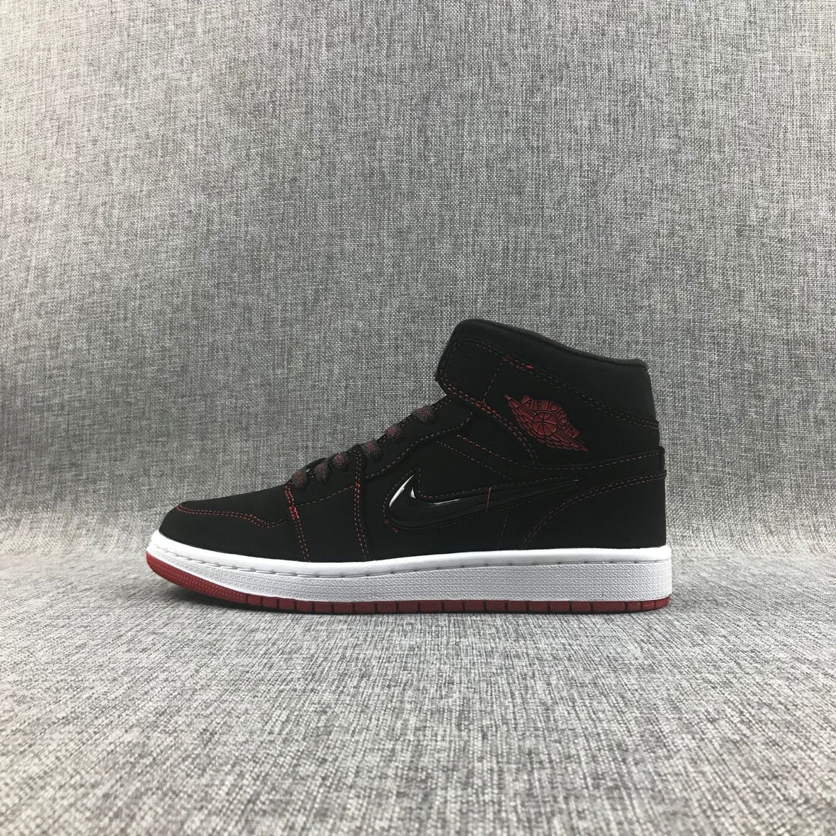 Air Jordan 1 Mid Sneakers Black Red CK5665-062 - product image from the listing.