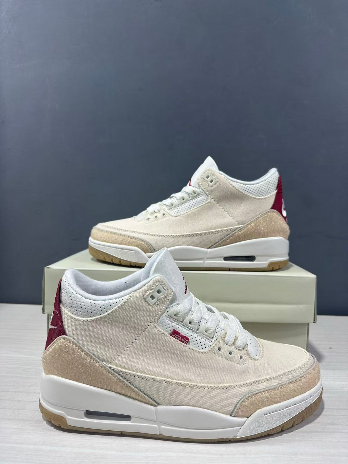 Air Jordan 3 Retro Jumpman Year of the Horse Sneakers Cream Red IR0910-400 - product image from the listing.