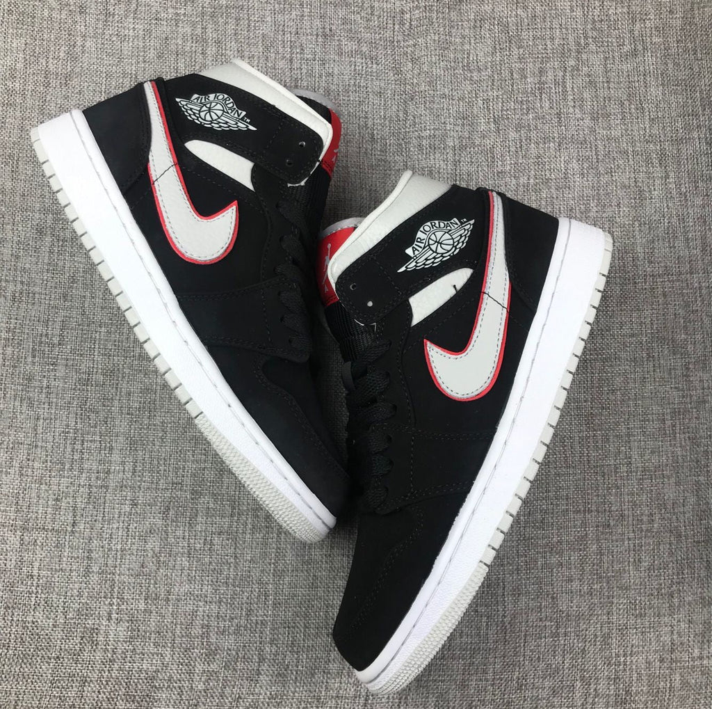 Air Jordan 1 Mid Black, Sneakers in White & Red 554724-060 - product image from the listing.