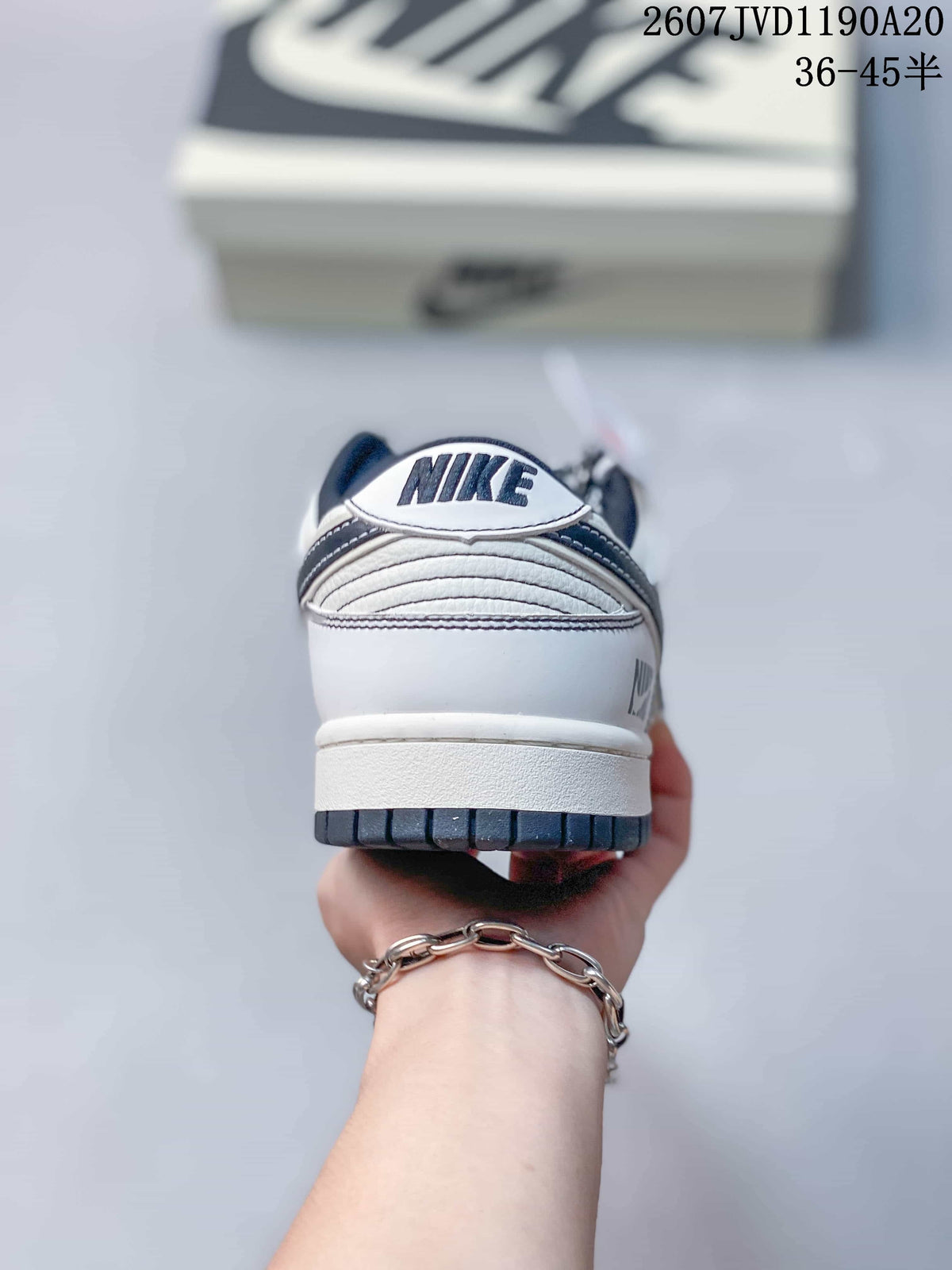 Nike SB Dunk Low Low-Top Sneakers in Off-White Black - product image from the listing.