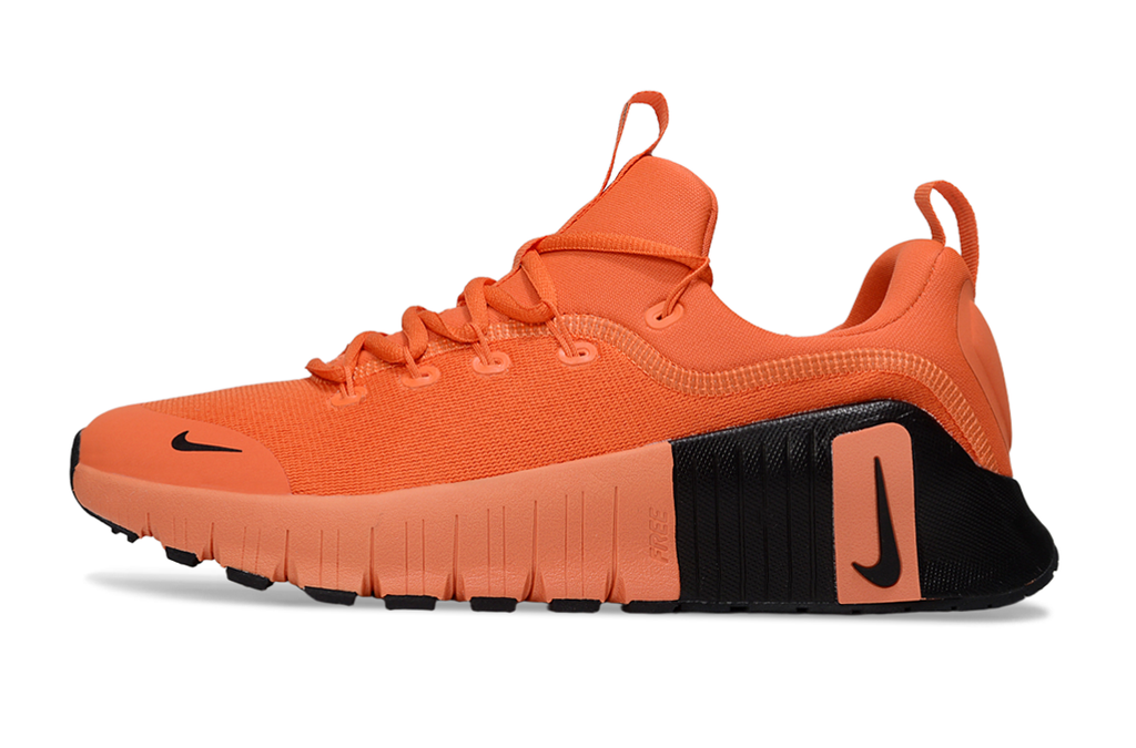 Orange and Black Nike Free Sneakers - product image from the listing.