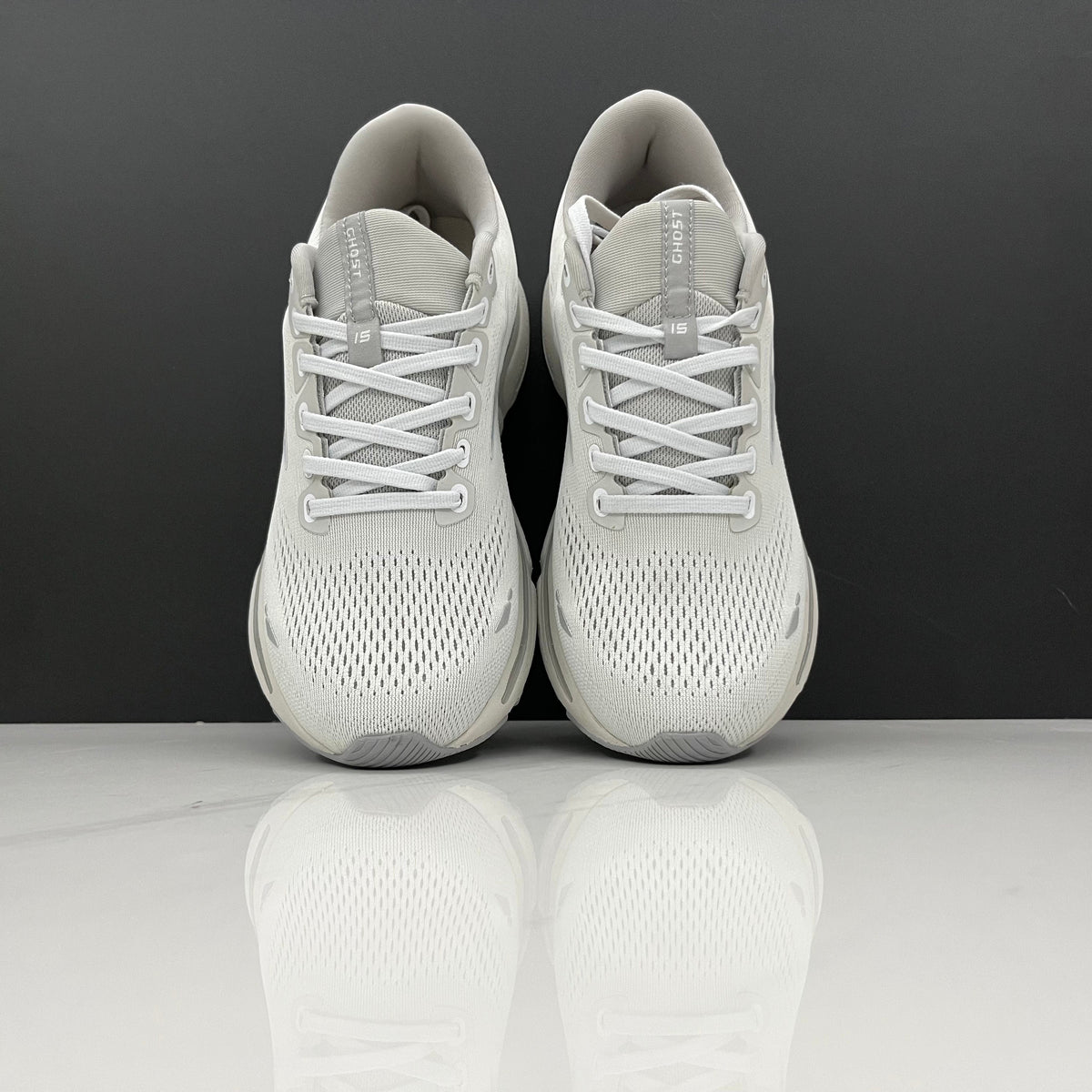 White and Grey Brooks Ghost 15 Running Shoes - product image from the listing.