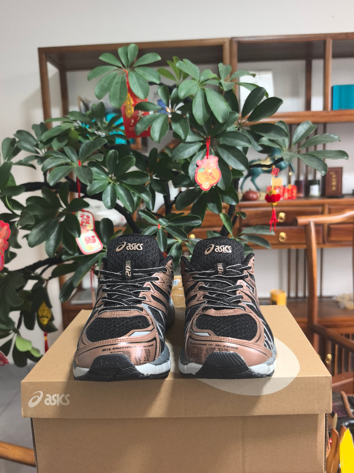 ASICS GEL-KAYANO 20 Sneakers in Black and Pale Pink - product image from the listing.