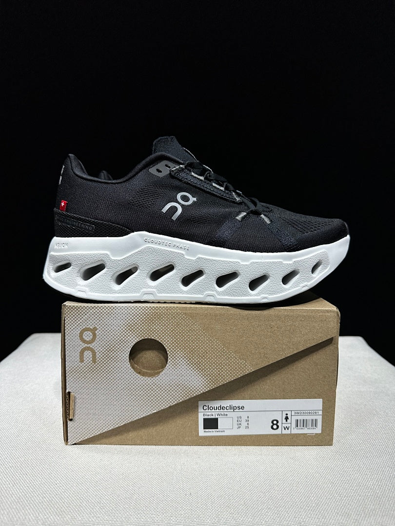 On CloudEclipse Running Shoes in Black and White - product image from the listing.