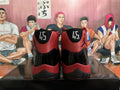 Jordan 11 High-Top Sneakers in Black and Red - product image from the listing.