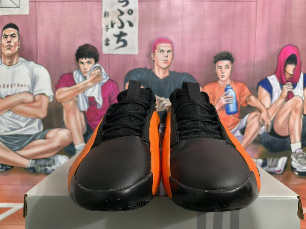 Basketball Sneakers in Black and Orange - product image from the listing.