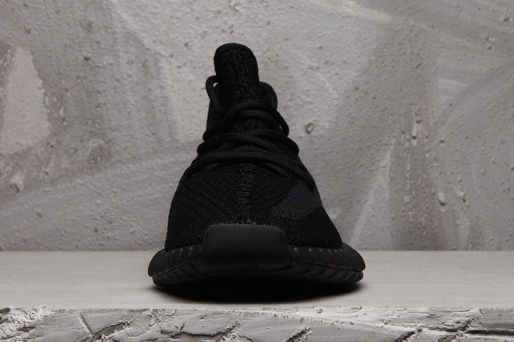 Yeezy 350 V2 Low-Top Sneakers in Black - product image from the listing.