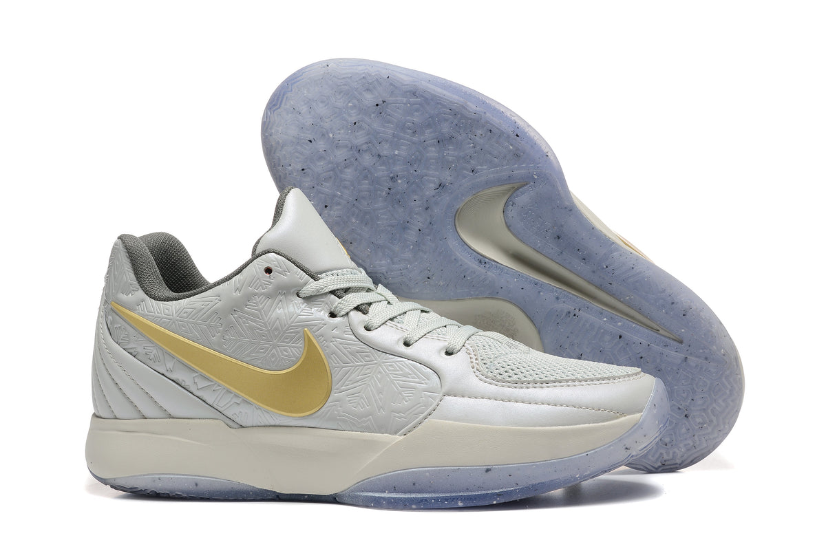 Gray and Gold Nike Kyrie Low Basketball Shoes - product image from the listing.