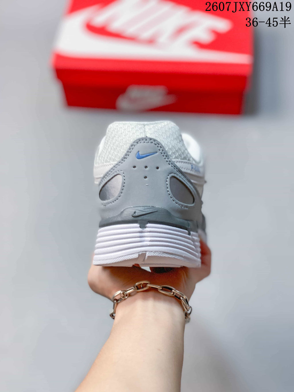 Nike P-6000 Retro Running Sneakers in White Grey Blue - product image from the listing.