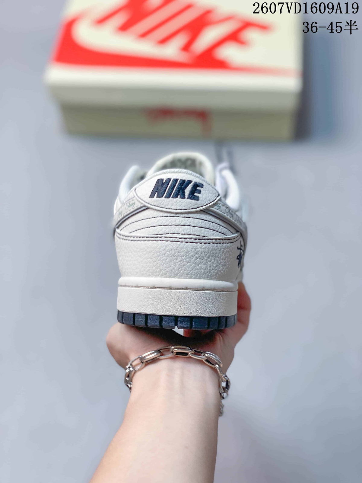 Nike Dunk Low Retro Sneakers in White Navy 2607VD1609A19 - product image from the listing.
