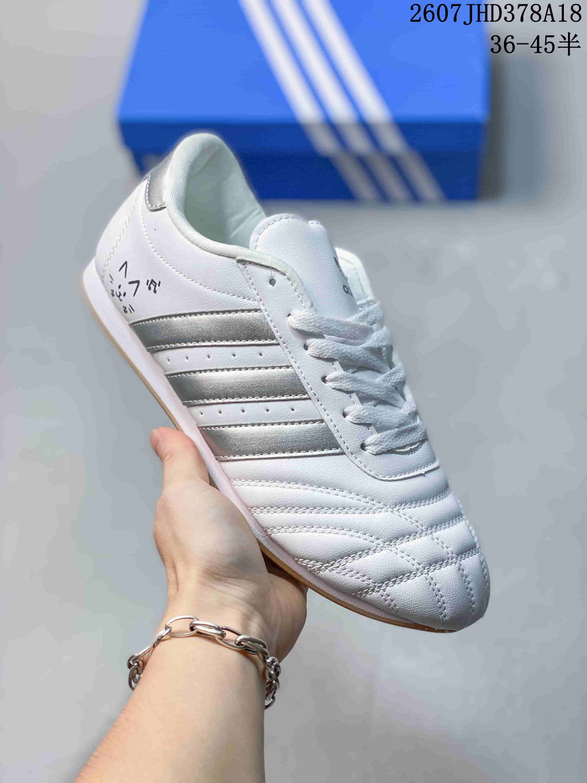 adidas Taekwondo SMIL-LS Low-Top Sneakers in White Silver - product image from the listing.