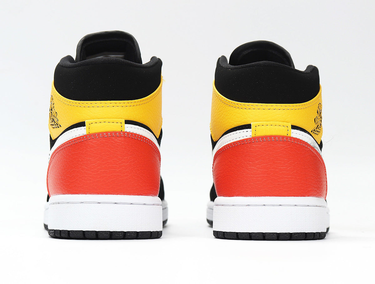 Jordan 1 Low Sneakers in Black Yellow Red 852542-087 - product image from the listing.