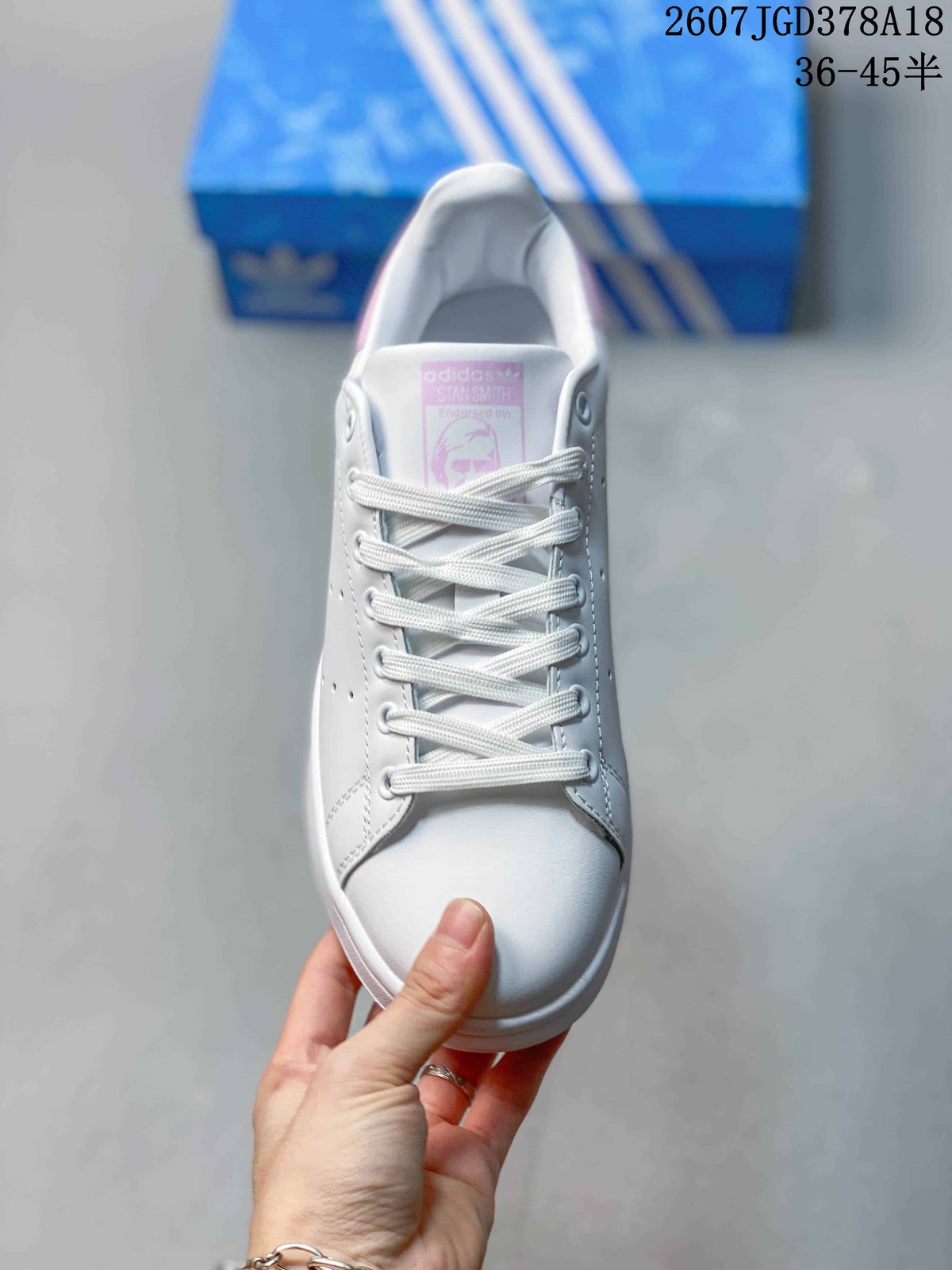 adidas Stan Smith Low-Top Sneakers in White and Pink - product image from the listing.