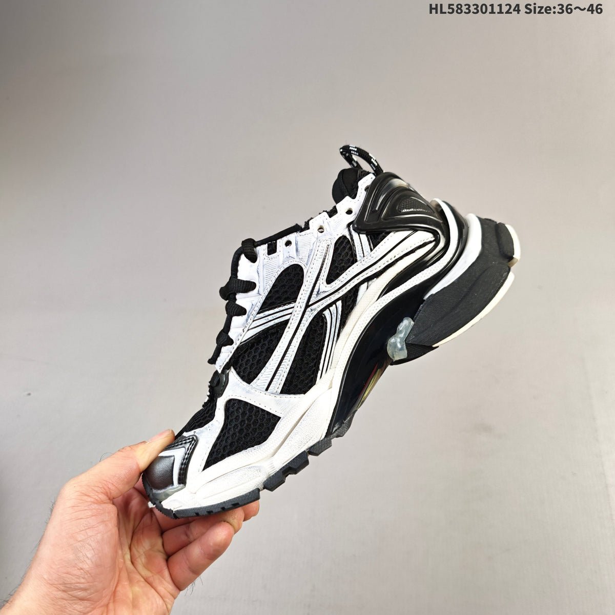 Black and White Balenciaga Runner Low-Top Sneakers - product image from the listing.
