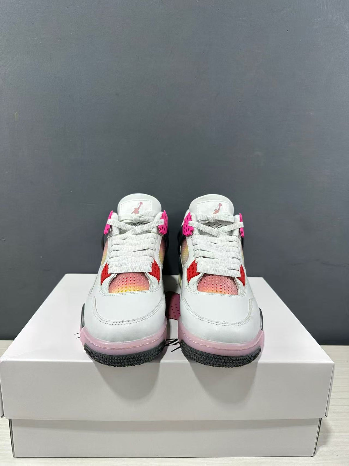 Air Jordan 4 Retro Comic Sneakers White Black Pink JA1135-100 - product image from the listing.