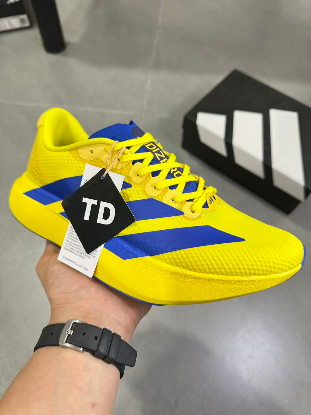 Adidas Lightstrike Pro Running Shoes, in Yellow and Blue - product image from the listing.