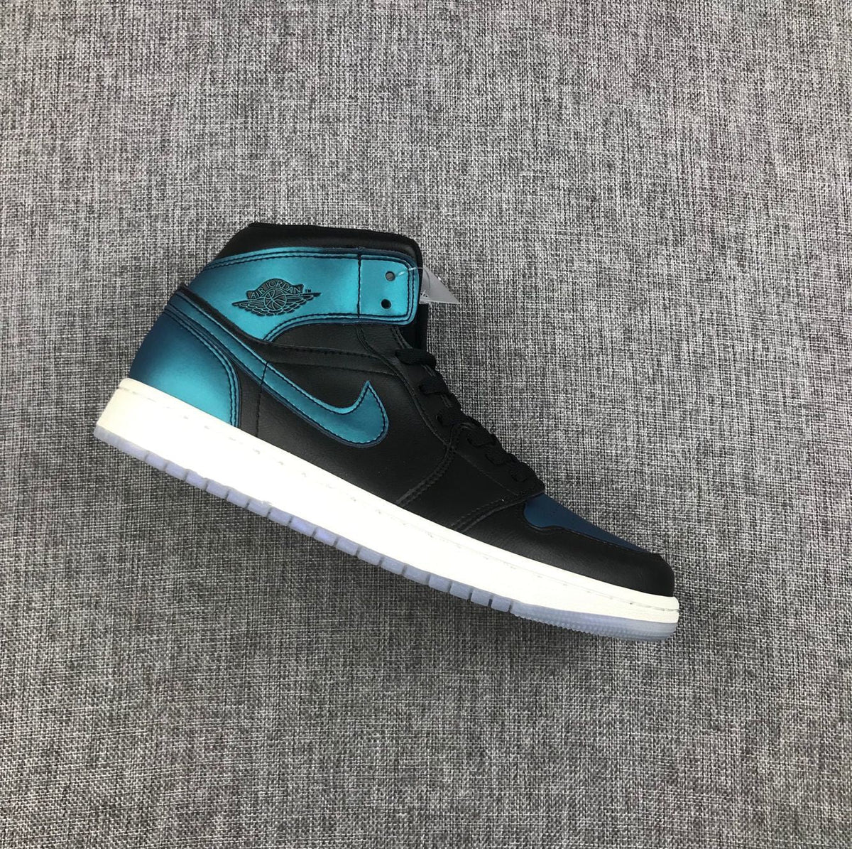 Air Jordan 1 Mid BQ6472-009 Sneakers in Black and Turquoise - product image from the listing.