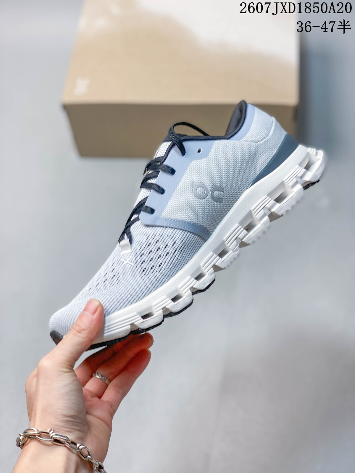 On Cloud X 4 Sneakers in Light Gray White Navy JXD1850A20 - product image from the listing.
