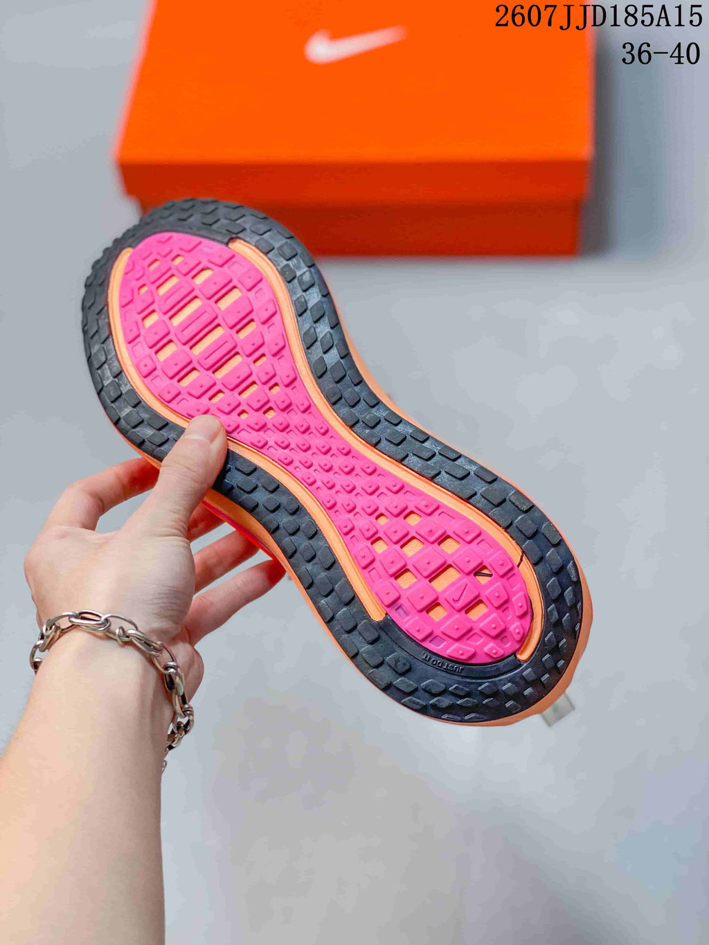 Nike Vomero Plus Running Shoes in White Orange Pink 2607JJD185A15 - product image from the listing.