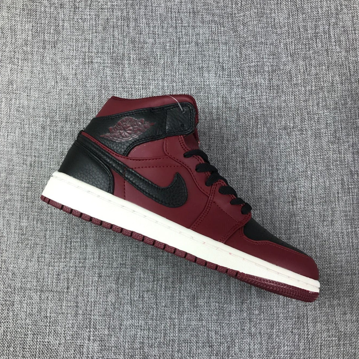 Air Jordan 1 Mid High-Top Sneakers in Burgundy and Black - product image from the listing.