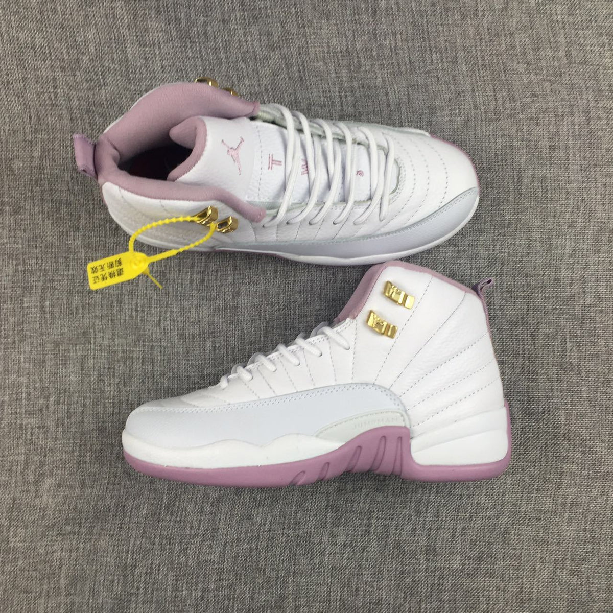 Air Jordan 12 Cherry Blossom Pink Sneakers - product image from the listing.