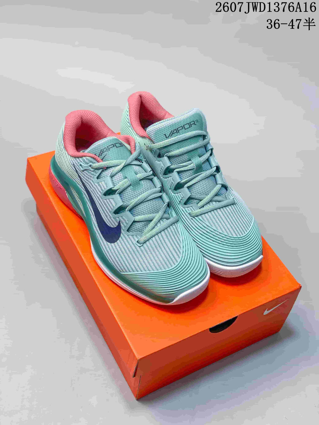 Mint Green and Coral Nike Vapor 12 Low-Top Tennis Sneakers - product image from the listing.