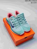 Mint Green and Coral Nike Vapor 12 Low-Top Tennis Sneakers - product image from the listing.