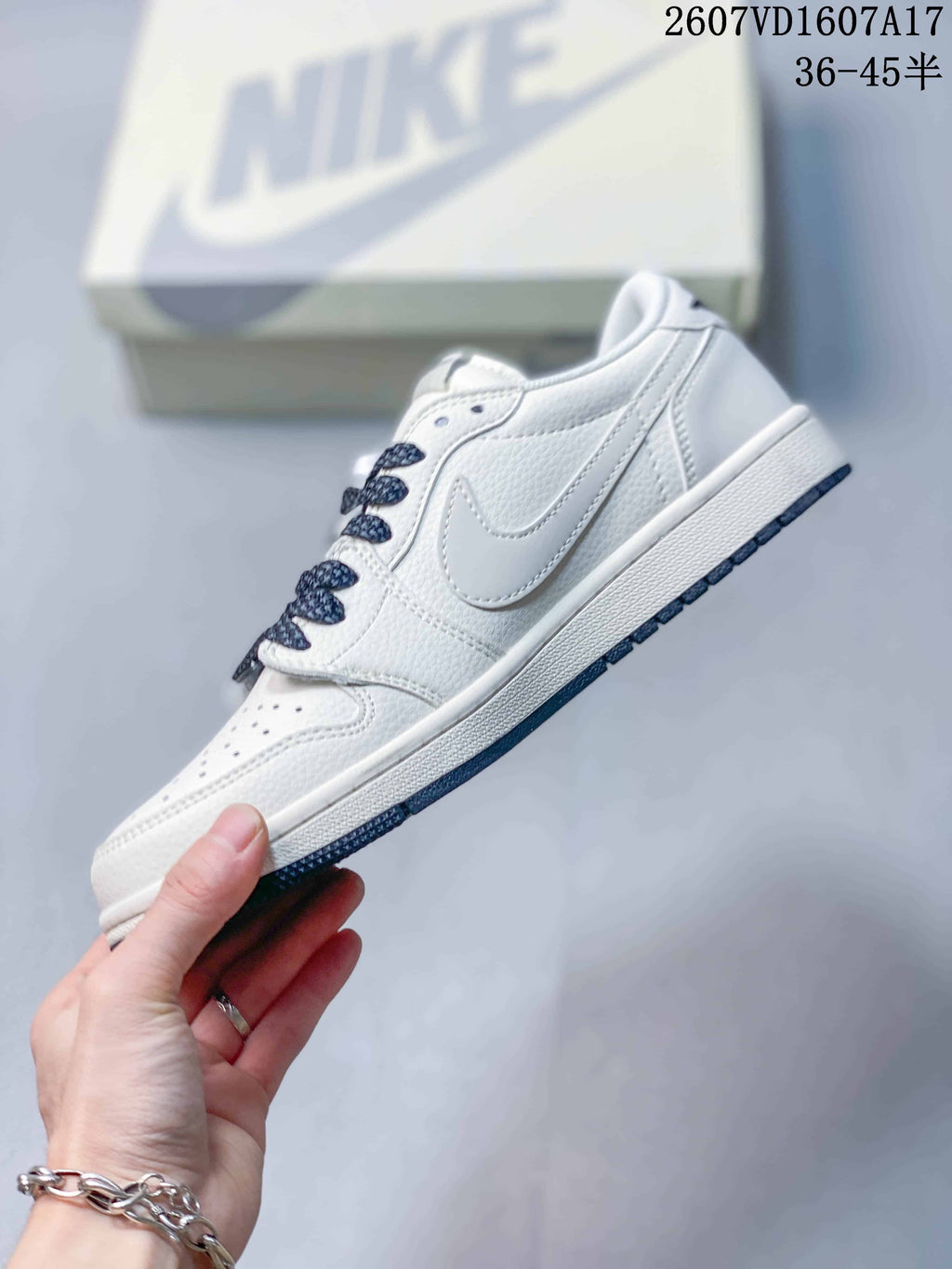 Travis Scott x Jordan 1 Low Sneakers in White Black 2607VD1607A17 - product image from the listing.