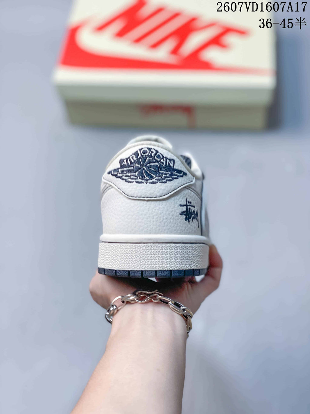 Jordan 1 Low Travis Scott x Stussy Sneakers in White Gray - product image from the listing.