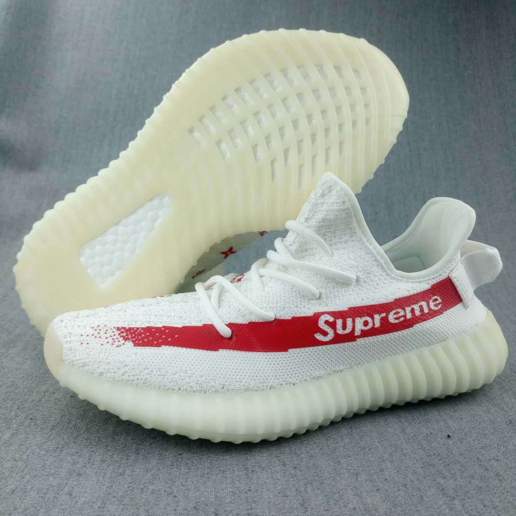 Yeezy 350 V2 Low-Top Sneakers in White and Red - product image from the listing.