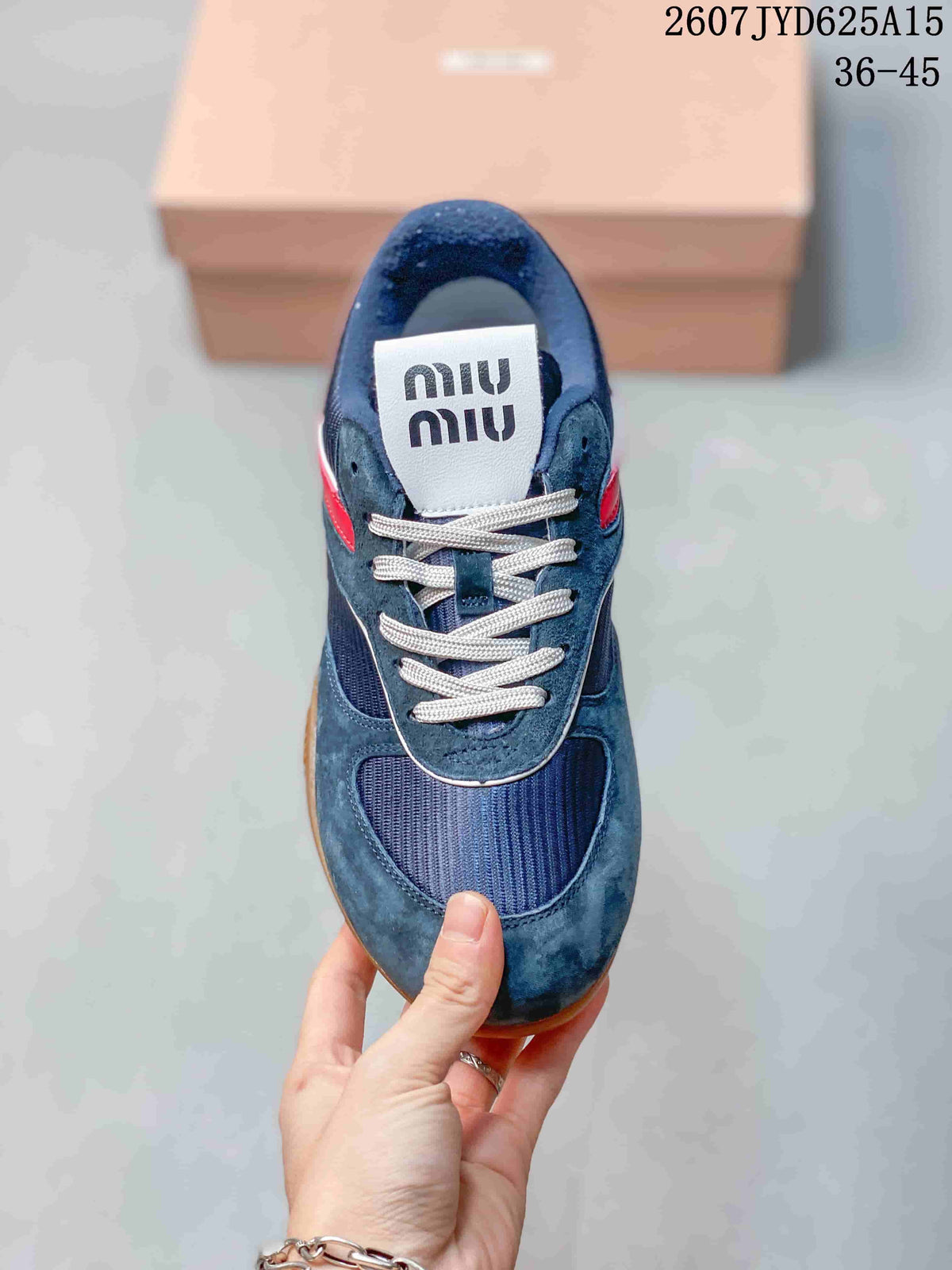 Miu Miu Gymnasium Low-Top Sneakers in Navy Red 2607JYD625A15 - product image from the listing.