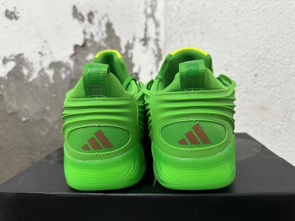 Adidas Green Basketball Trainers with Yellow Accents - product image from the listing.