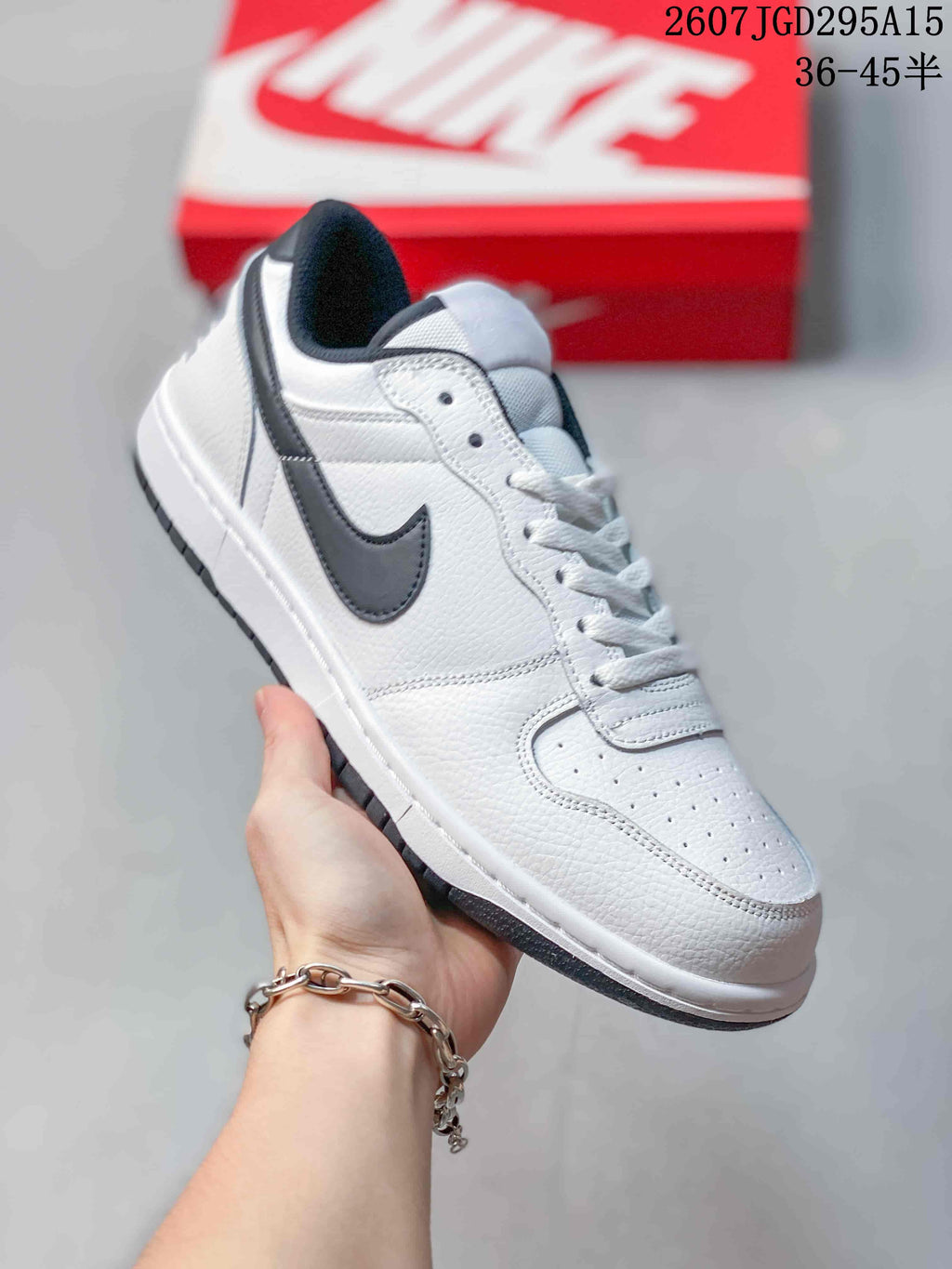 Nike SB Dunk Low Pro Sneakers in White Black 2607TGD295A15 - product image from the listing.