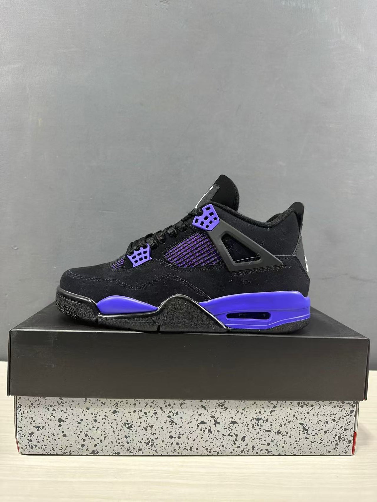 Air Jordan 4 Retro Black Blue Sneakers CT8527-018 - product image from the listing.