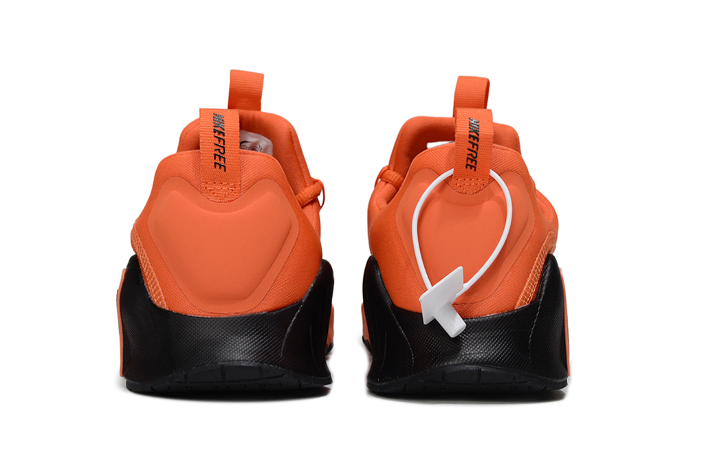 Orange and Black Nike Free Sneakers - product image from the listing.