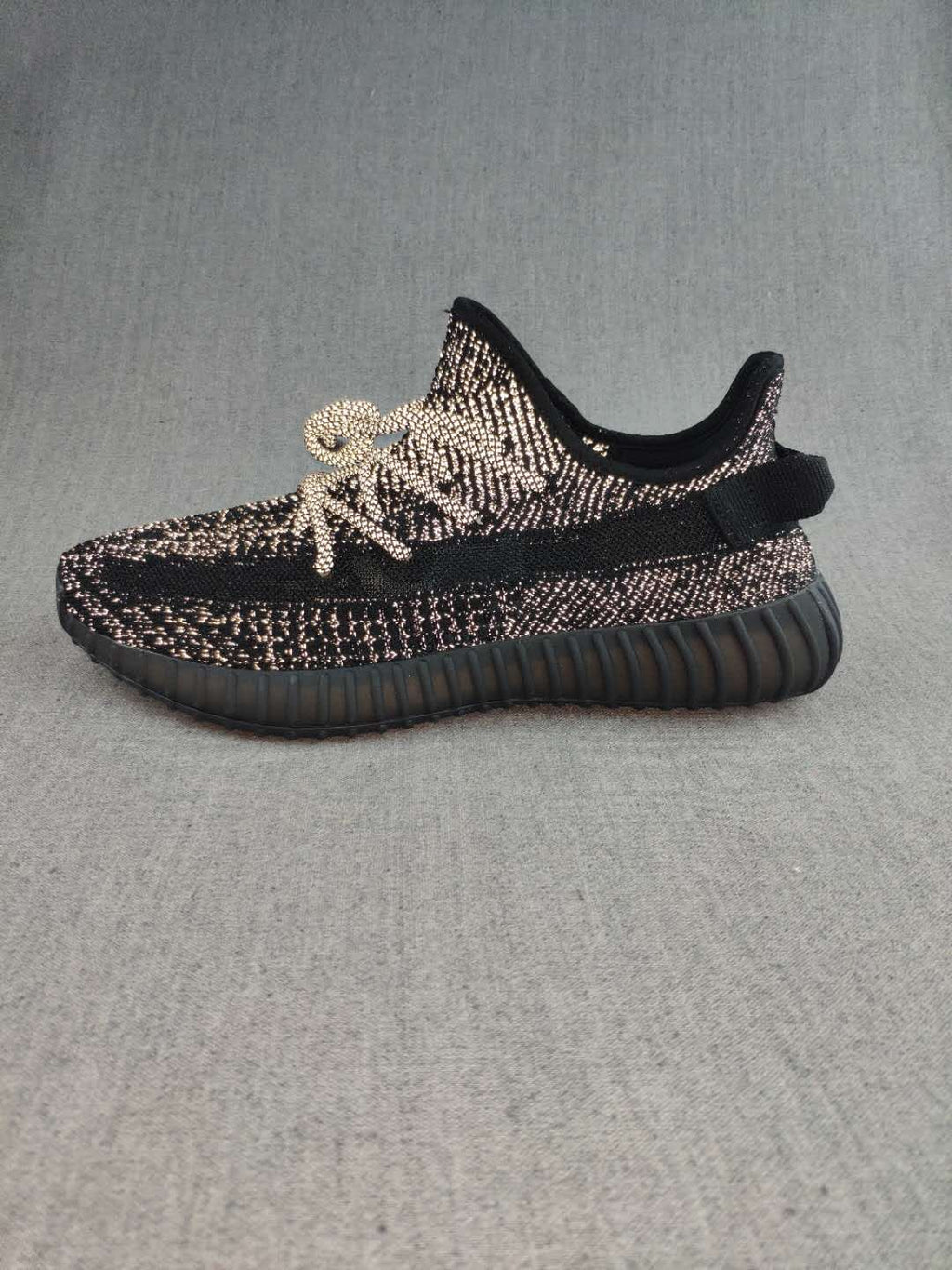 Black and Cream Yeezy 350 V2 Knit Sneakers - product image from the listing.