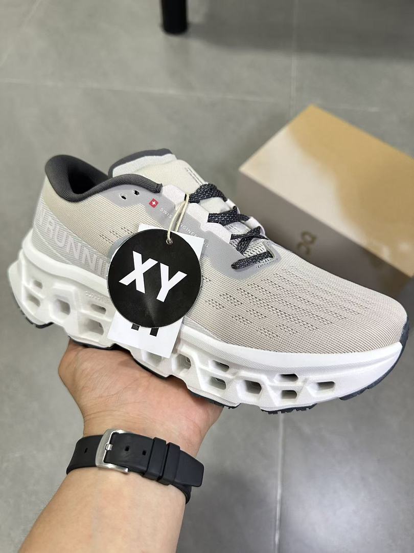 Gray and White On Running Cloudmonster Sneakers - product image from the listing.