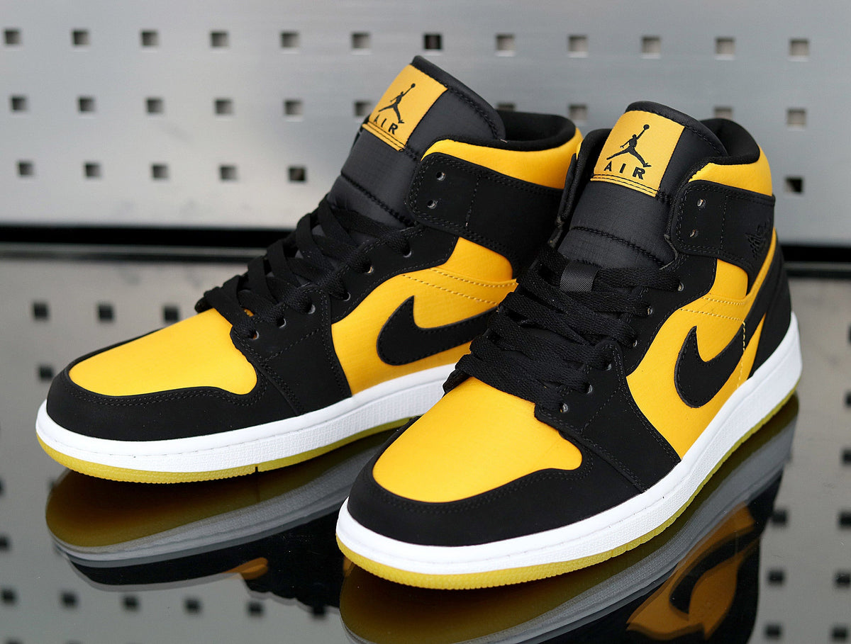 Jordan 1 High Sneakers in Yellow and Black - product image from the listing.