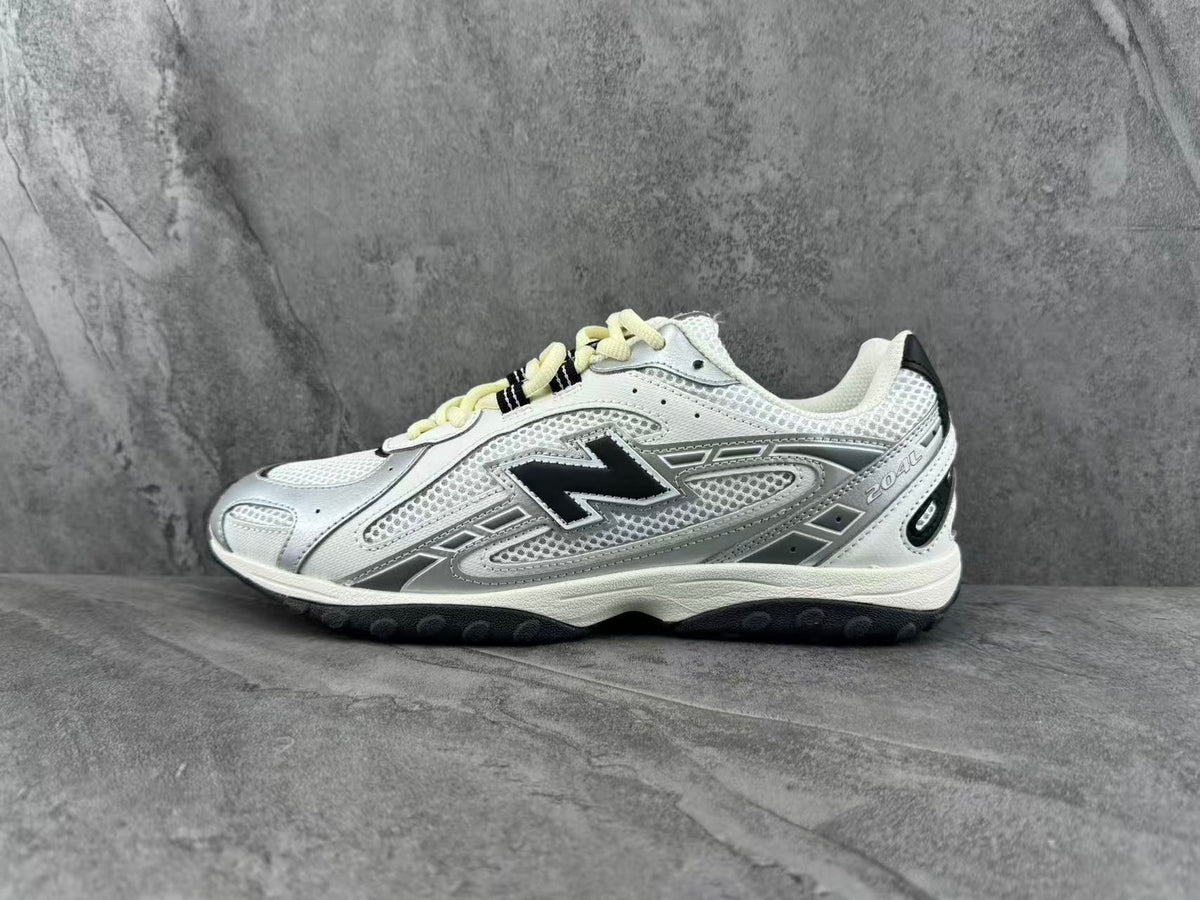 New Balance 204L Sneakers in Silver and White - product image from the listing.
