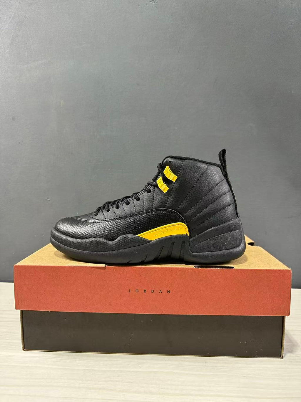 Air Jordan 12 Retro Black Taxi Sneakers CT8013-071 - product image from the listing.